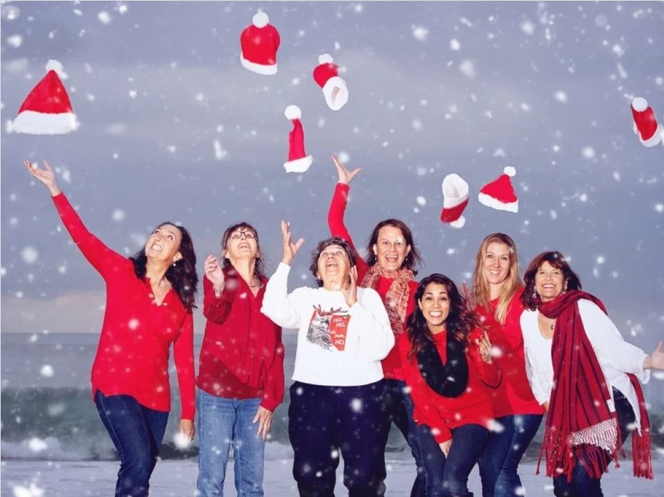 Acupuncture Team throwing their Santa hats in the air